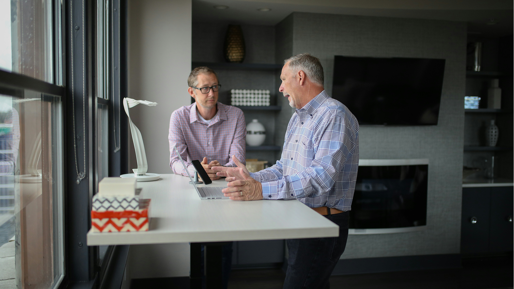 Financial professionals discussing options at a desk